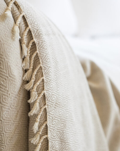 Maradji creme throw blanket with fringe